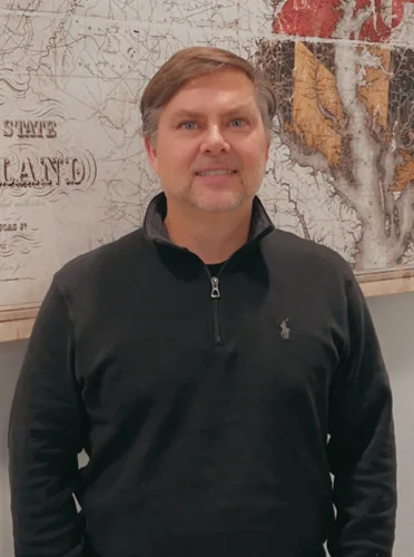 Wellness Care Baltimore MD Michael Dorn Thank You Dr. Michael Dorn smiling in front of a map.